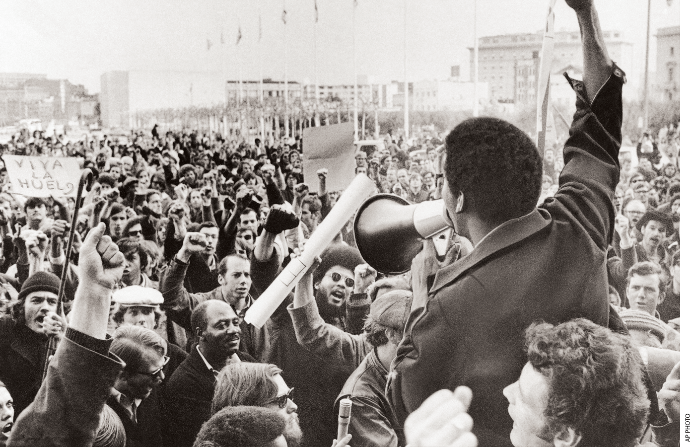 A Black Students Union leader in front of a crowd of demonstrators at College in December 1968.