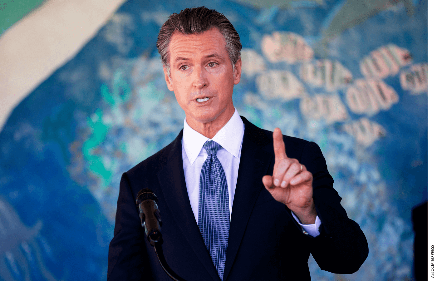 In this Aug. 11, 2021 file photo, California Gov. Gavin Newsom speaks during a news conference at the Carl B. Munck Elementary School in Oakland, Calif. While talking to reporters during an online interview, Friday, Aug. 13, 2021, Republican Larry Elder promised that if Newsom is ousted in the Sept. 14 election, any mask or vaccine mandates in place at the time 